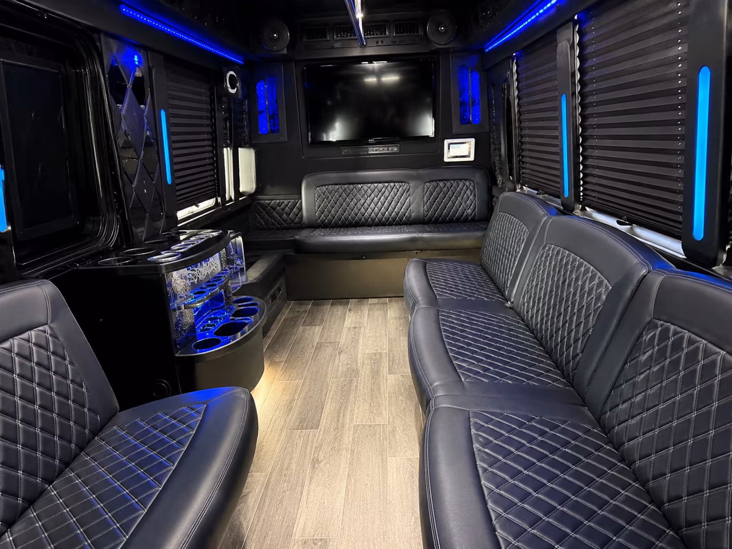 Wedding guests seated inside a party bus serving Meridian